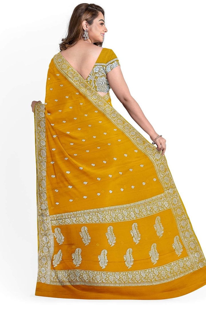 Banarasi silk chiffon  saree in yellow  with silver  buttis &  border