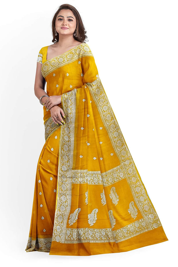 Banarasi silk chiffon  saree in yellow  with silver  buttis &  border