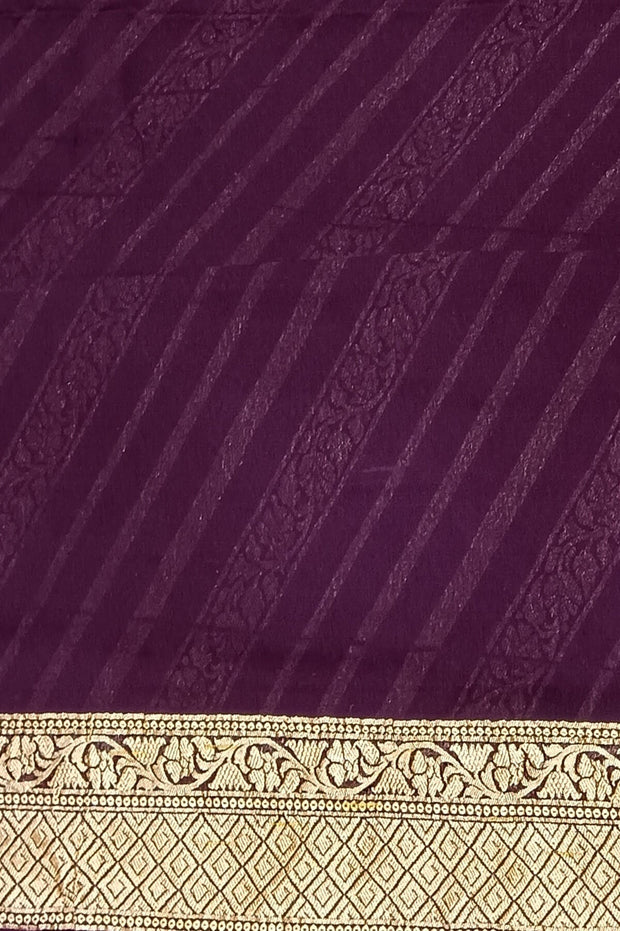 Banarasi khaddi silk georgette saree in brown with  diagonal lines on the body