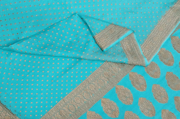 Banarasi silk georgette saree in  pool blue  with small motifs