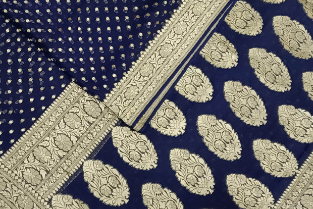 Banarasi silk georgette saree in  navy blue with small motifs