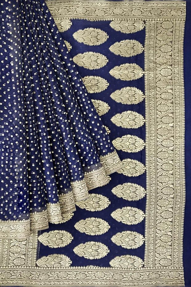 Banarasi silk georgette saree in  navy blue with small motifs