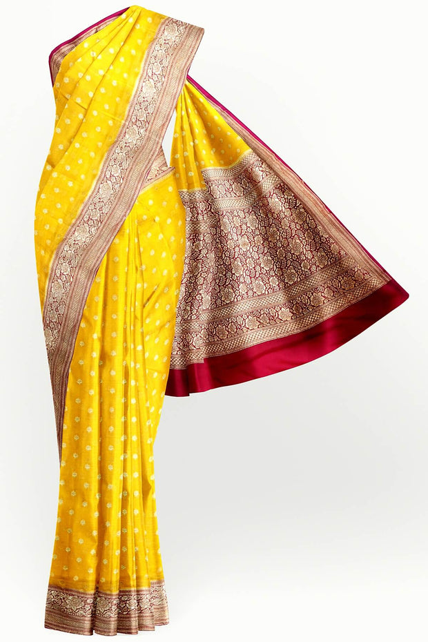 Banarasi silk georgette saree  in yellow with small motifs all over the body.