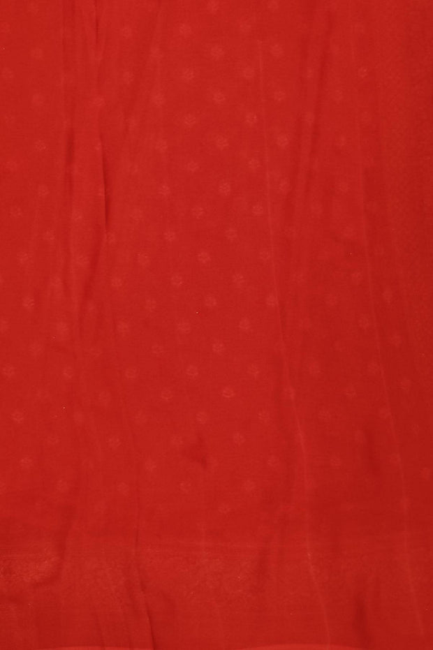 Banarasi silk georgette saree  in red with small motifs all over the body.
