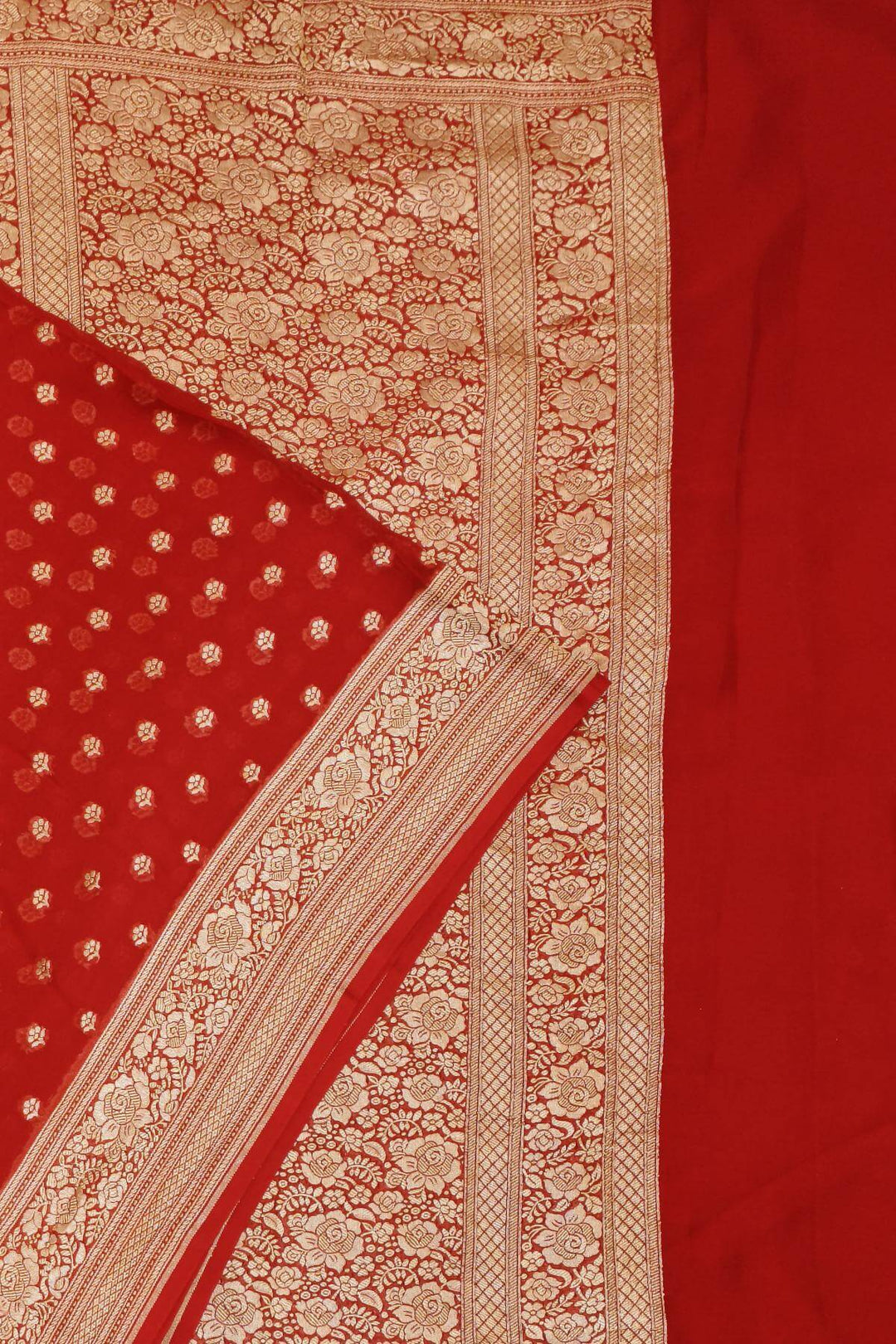 Banarasi silk georgette saree  in red with small motifs all over the body.