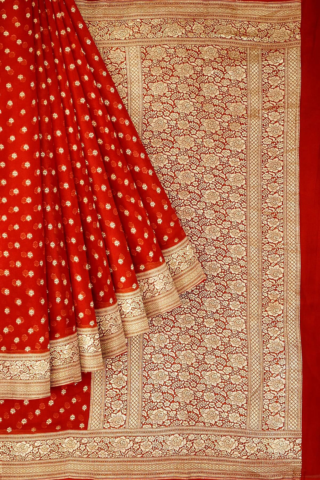 Banarasi silk georgette saree  in red with small motifs all over the body.