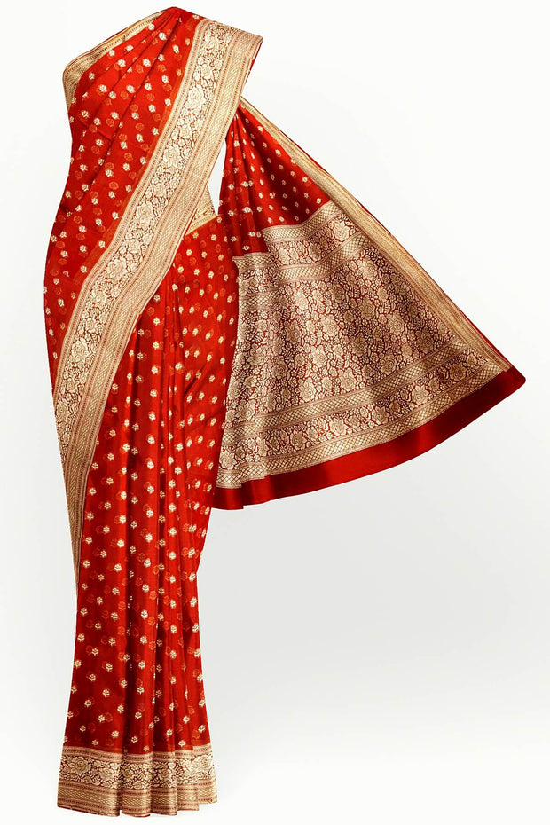 Banarasi silk georgette saree  in red with small motifs all over the body.