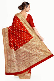 Banarasi silk georgette saree  in red with small motifs all over the body.