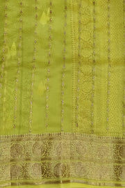 Banarasi kora (organza) silk saree  in bottle green with gold & silver motifs