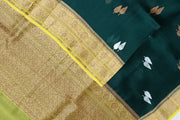 Banarasi kora (organza) silk saree  in bottle green with gold & silver motifs