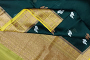 Banarasi kora (organza) silk saree  in bottle green with gold & silver motifs