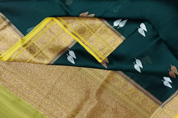 Banarasi kora (organza) silk saree  in bottle green with gold & silver motifs