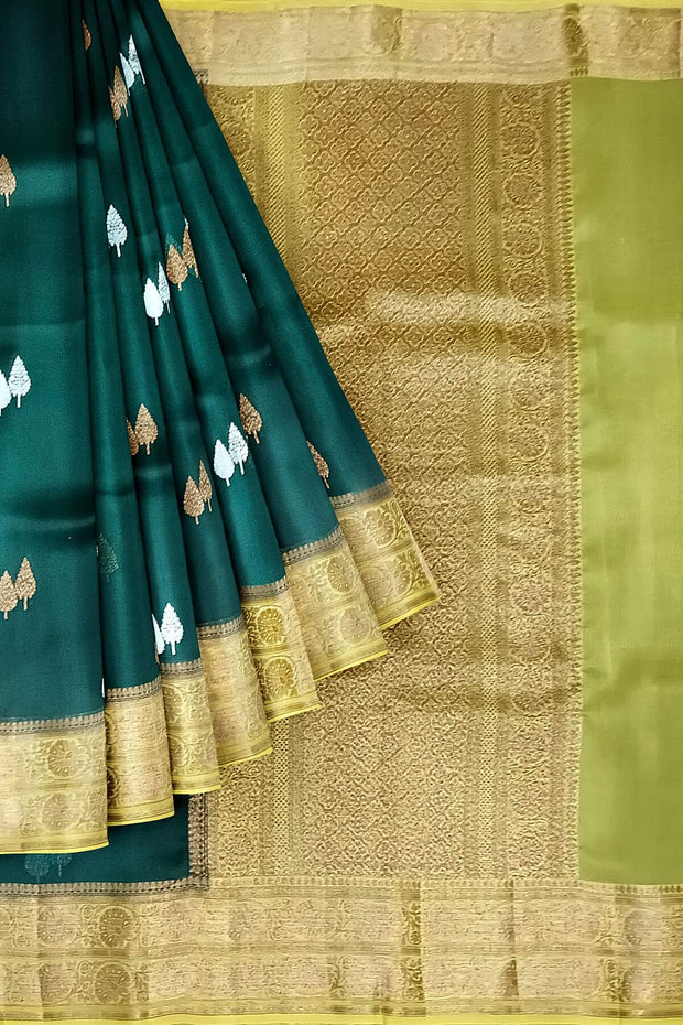 Banarasi kora (organza) silk saree  in bottle green with gold & silver motifs