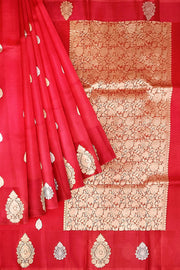Banarasi kora (organza) silk saree in red with   floral motifs in gold & silver.