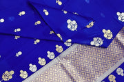 Banarasi kora (organza) silk saree in royal blue with   floral motifs in gold & silver.