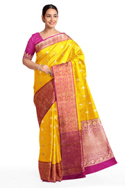 Handloom Banarasi katan pure silk saree in yellow with rich zari border.