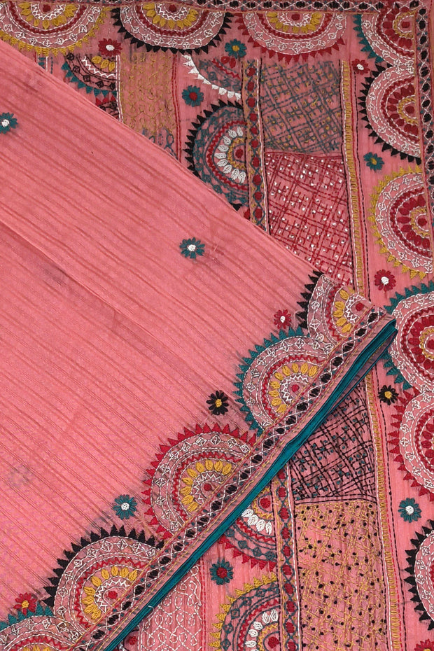 Lambani hand embroidery on a  chanderi saree in  peach