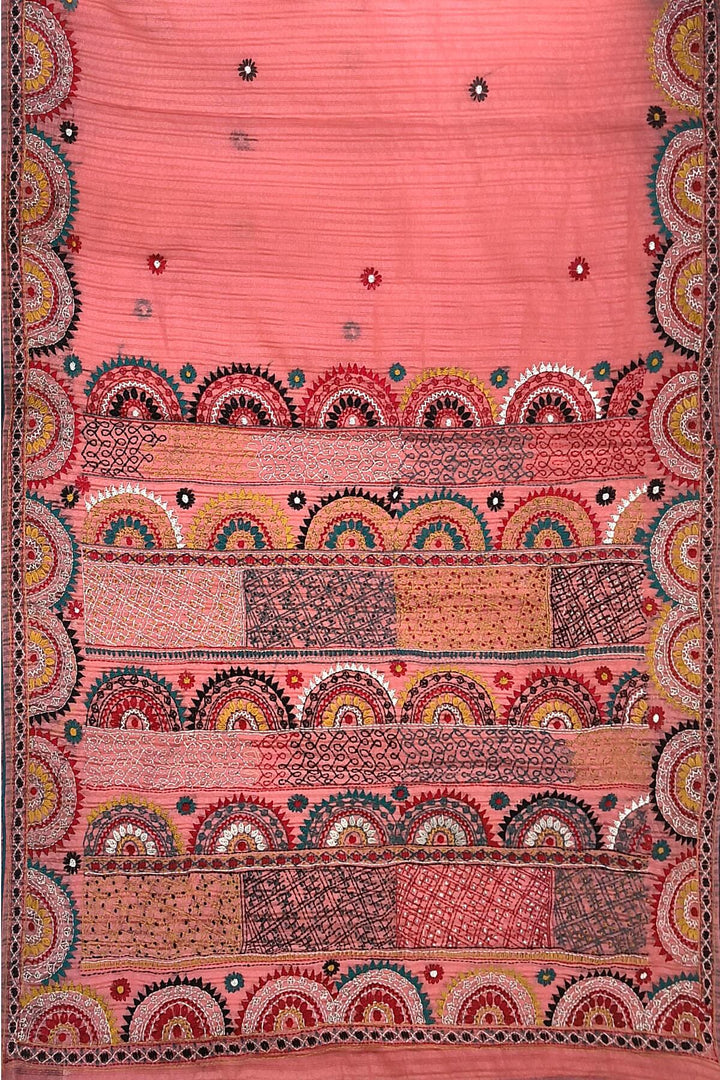 Lambani hand embroidery on a  chanderi saree in  peach