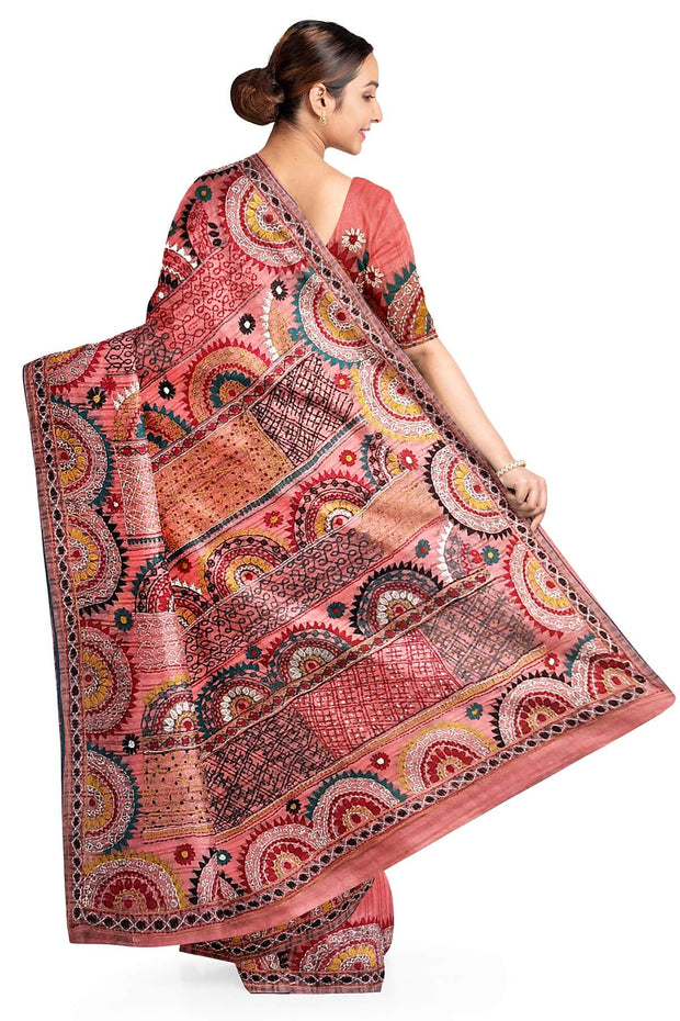 Lambani hand embroidery on a  chanderi saree in  peach