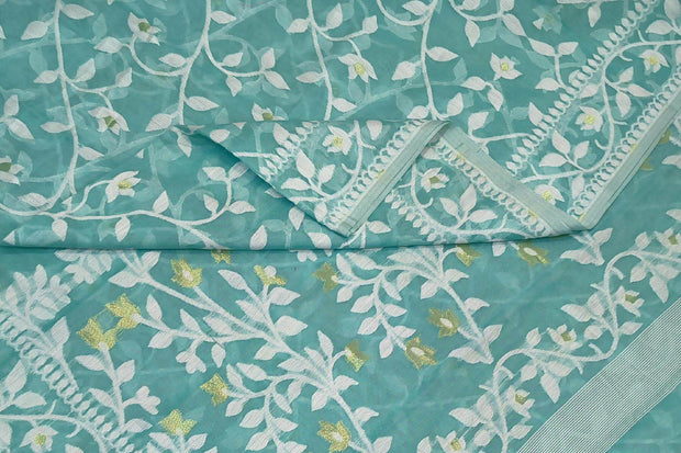 Handloom silk cotton saree in teal green in floral jamdani weave