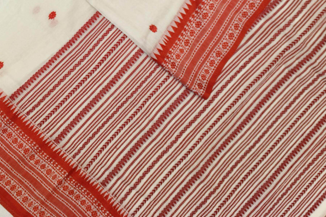 Mercersed cotton saree in white with bhujodi worked   pallu & border.