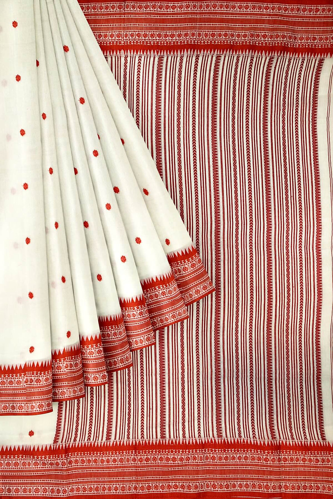 Mercersed cotton saree in white with bhujodi worked   pallu & border.