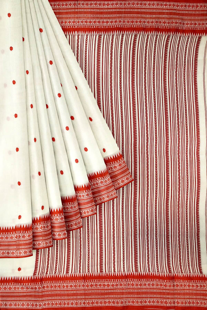 Mercersed cotton saree in white with bhujodi worked   pallu & border.