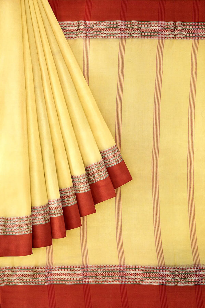 Soft cotton saree in light yellow with Dhonekali thread work pallu & border