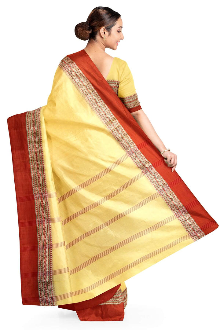 Soft cotton saree in light yellow with Dhonekali thread work pallu & border