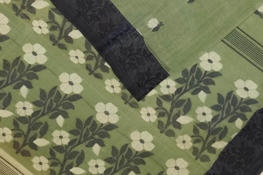 Cotton saree in green with floral motifs in Jamdani weave