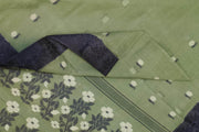 Cotton saree in green with floral motifs in Jamdani weave