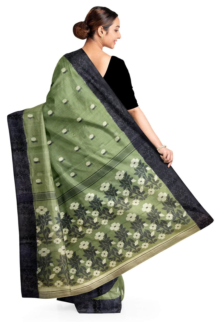 Cotton saree in green with floral motifs in Jamdani weave