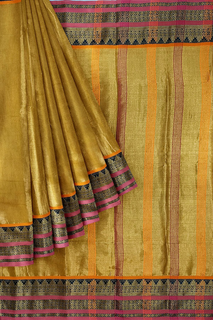 Soft tissue cotton saree in gold with temple border