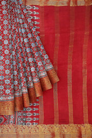 Dola silk saree in hand block ajrakh print  in  red with diamond motifs