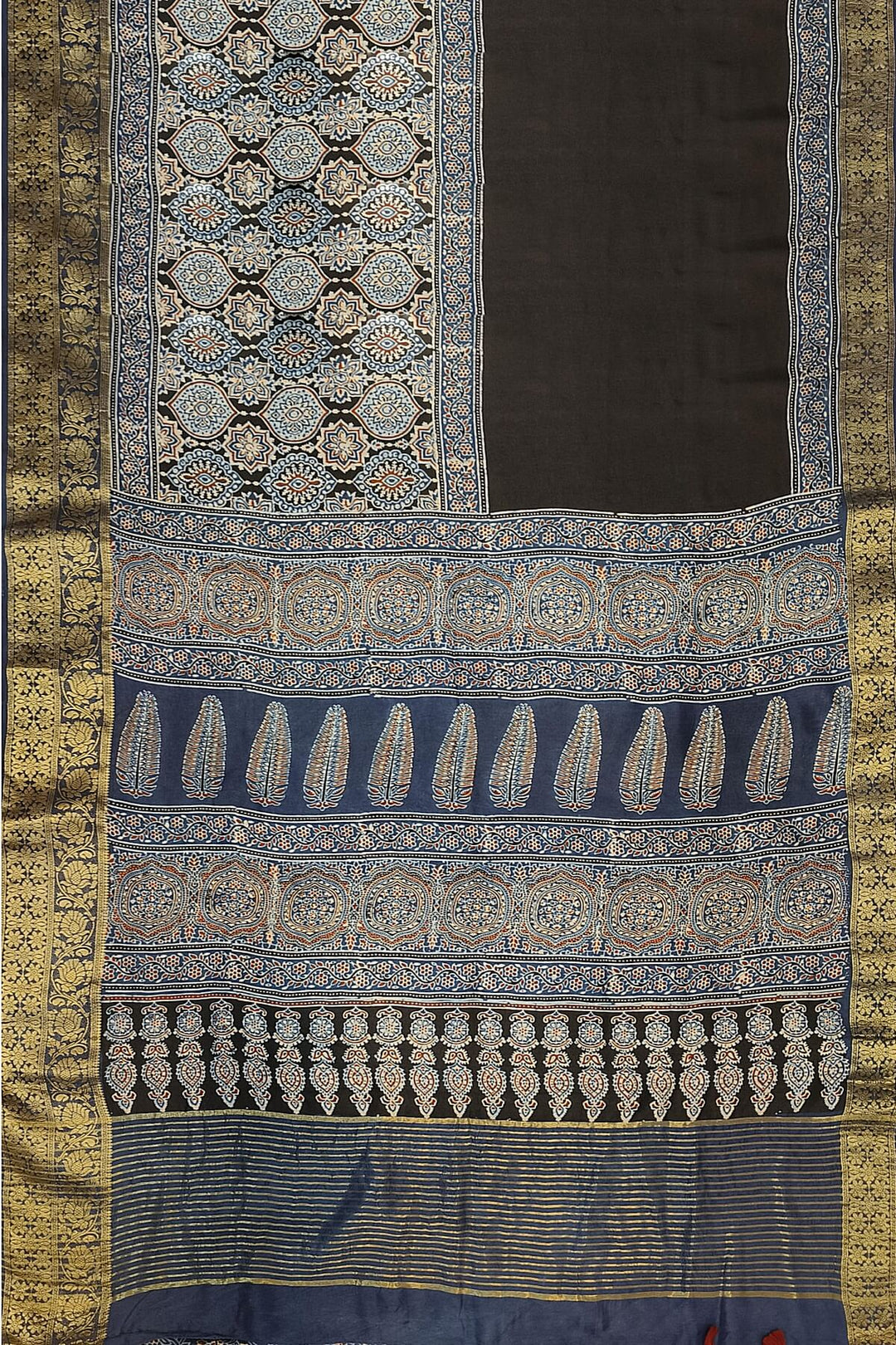 Dola silk saree in blue & black with floral motifs in  hand block Ajrakh print .