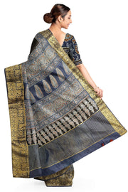 Dola silk saree in blue & black with floral motifs in  hand block Ajrakh print .