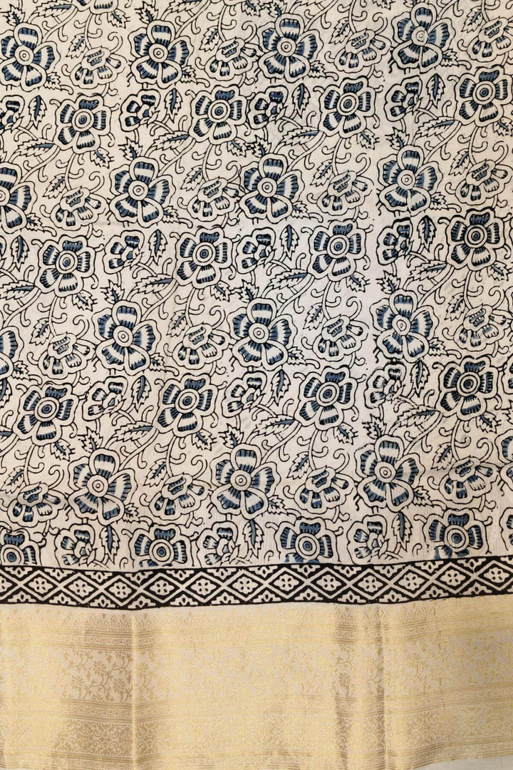 Dola silk saree in white with   hand block Ajrakh print .