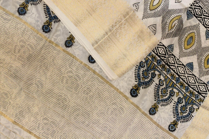 Dola silk saree in white with   hand block Ajrakh print .