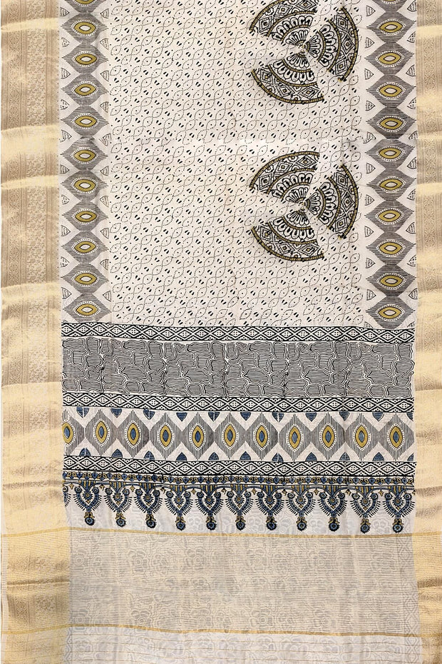 Dola silk saree in white with   hand block Ajrakh print .