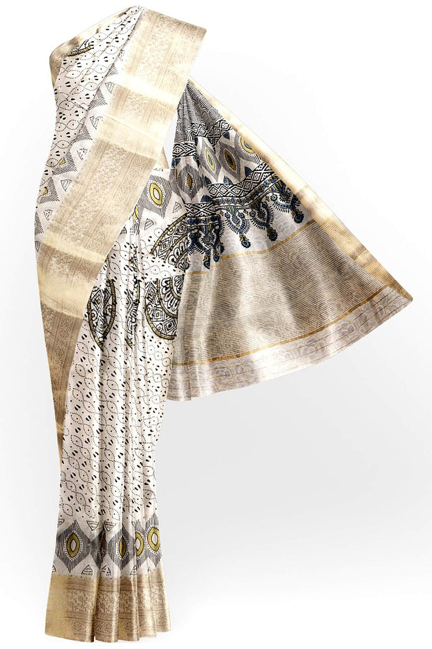 Dola silk saree in white with   hand block Ajrakh print .