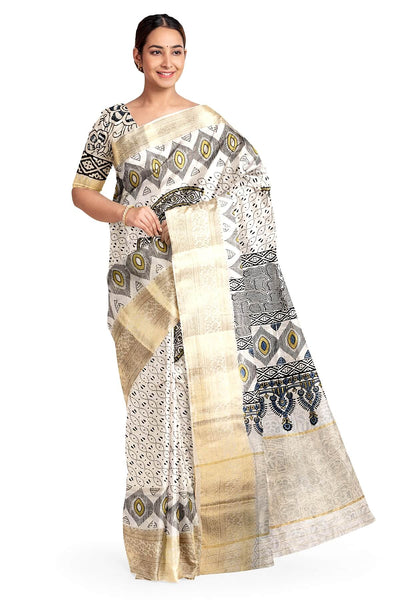 Dola silk saree in white with   hand block Ajrakh print .