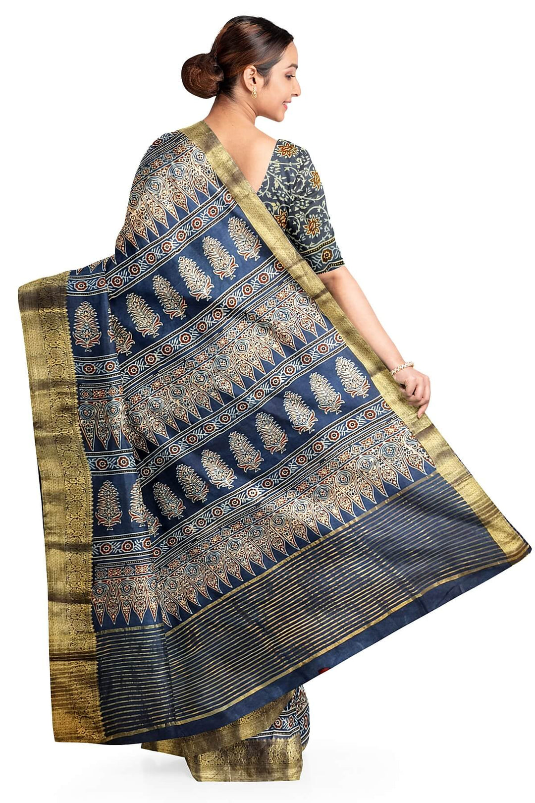Dola silk saree in blue  with floral motifs in  hand block Ajrakh print .