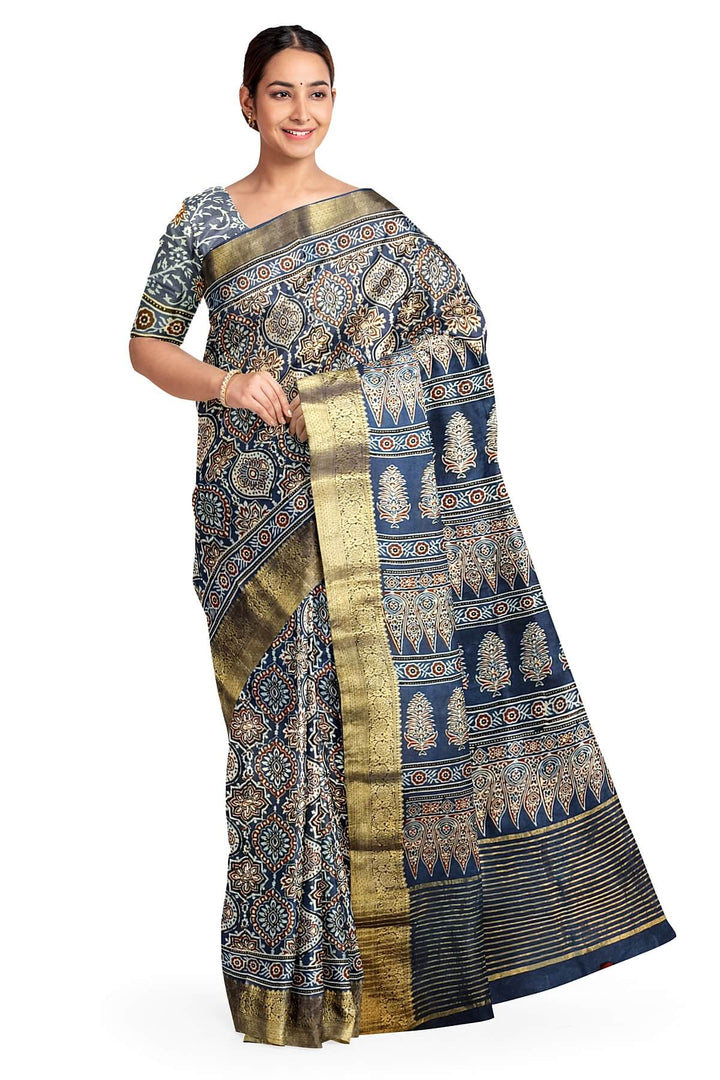 Dola silk saree in blue  with floral motifs in  hand block Ajrakh print .