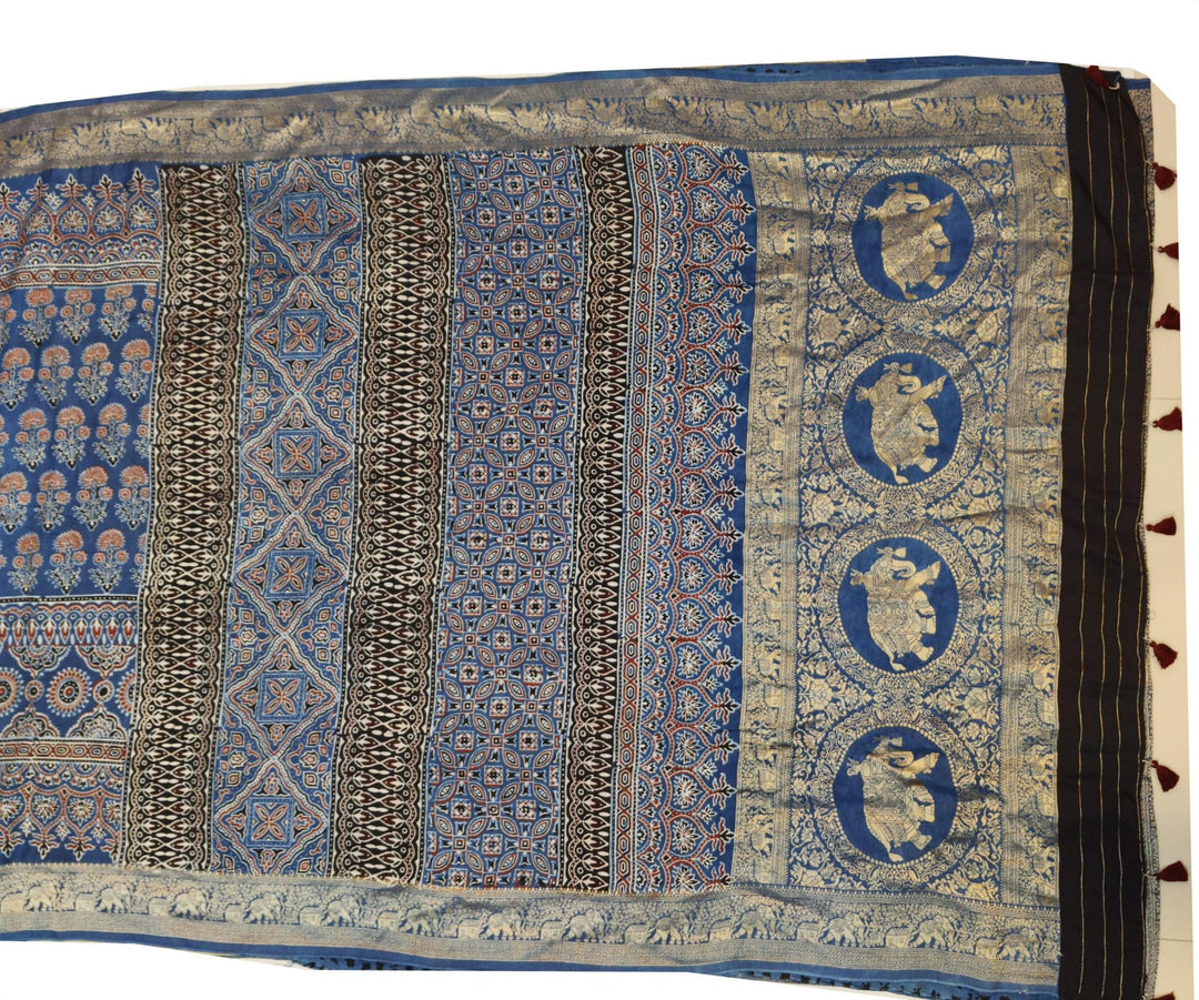 Dola silk saree in blue & red with floral motifs and a skirt border in hand block Ajrakh print