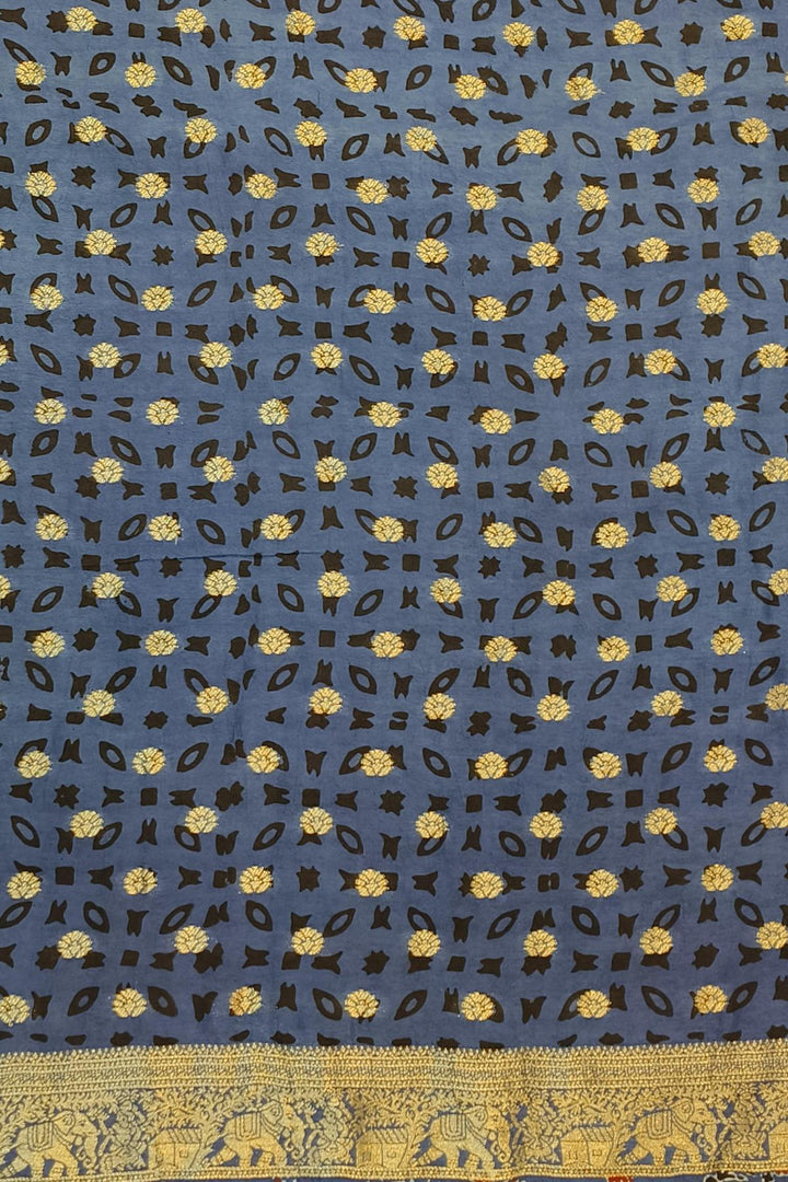 Dola silk saree in blue & red with floral motifs and a skirt border in hand block Ajrakh print