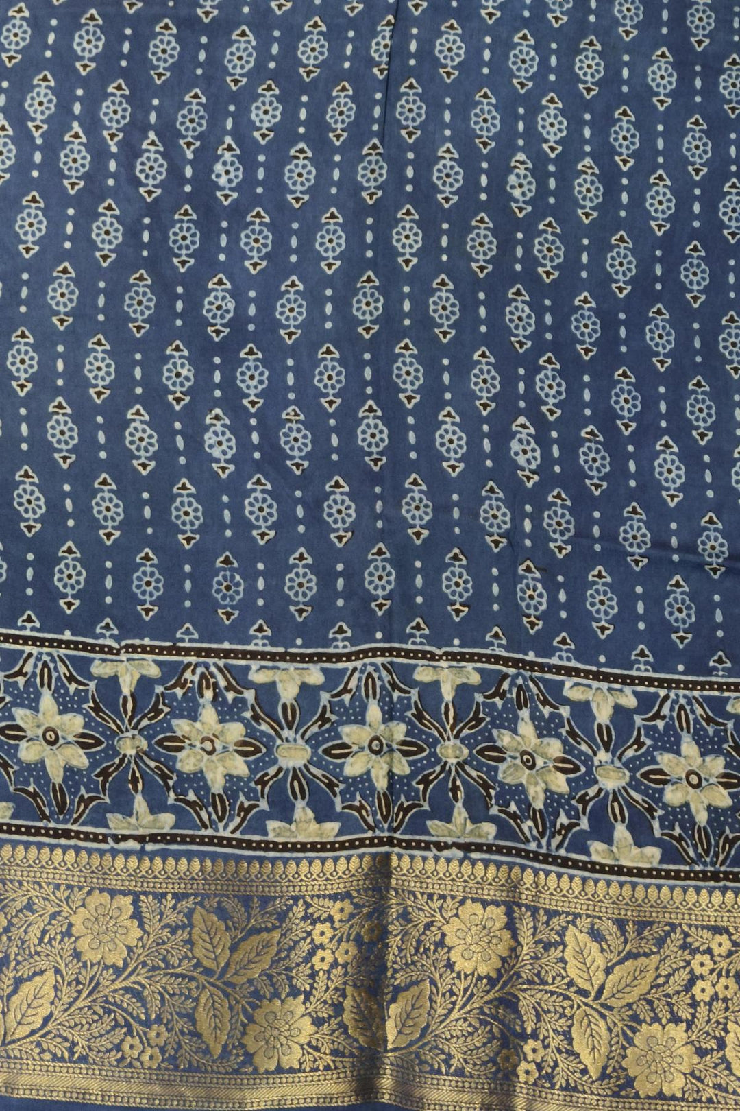 Dola silk saree in indigo  with floral motifs in circles  in hand block Ajrakh print