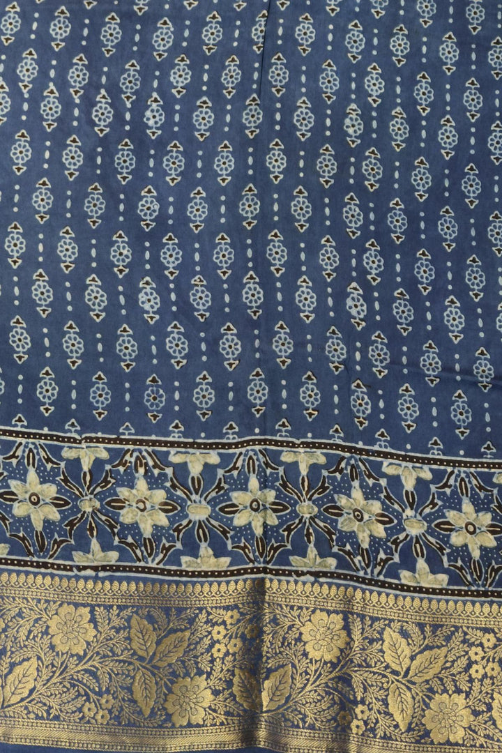 Dola silk saree in indigo  with floral motifs in circles  in hand block Ajrakh print