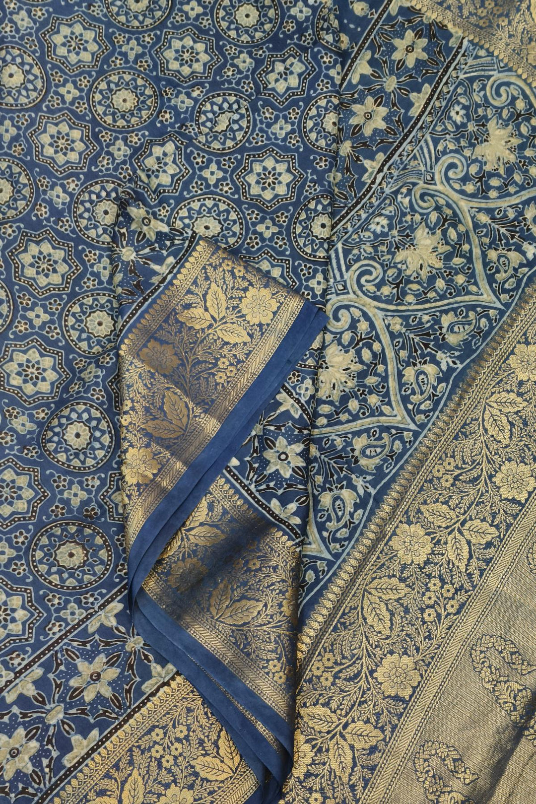 Dola silk saree in indigo  with floral motifs in circles  in hand block Ajrakh print