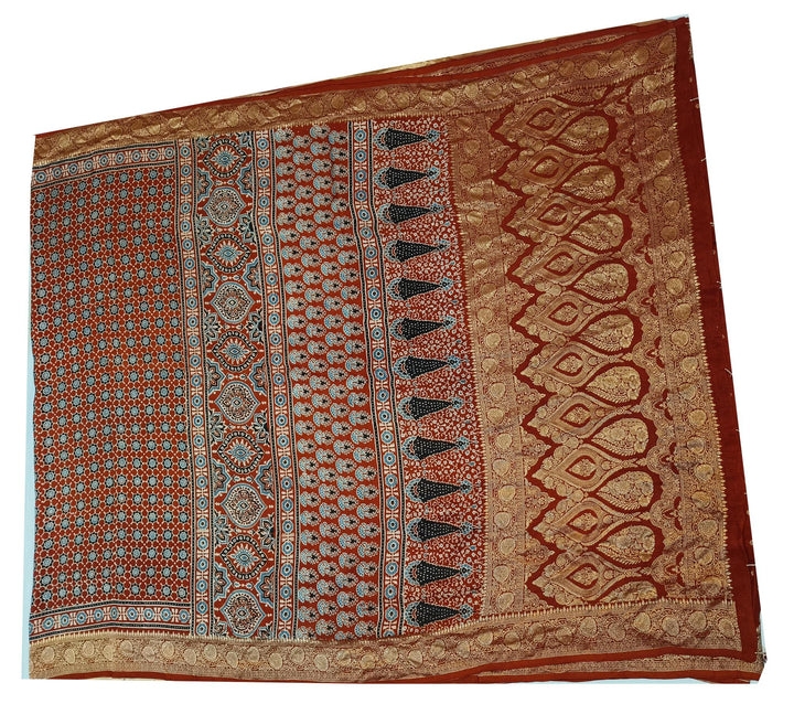 Dola silk saree in red with small motifs  and a contrast pallu in hand block Ajrakh print