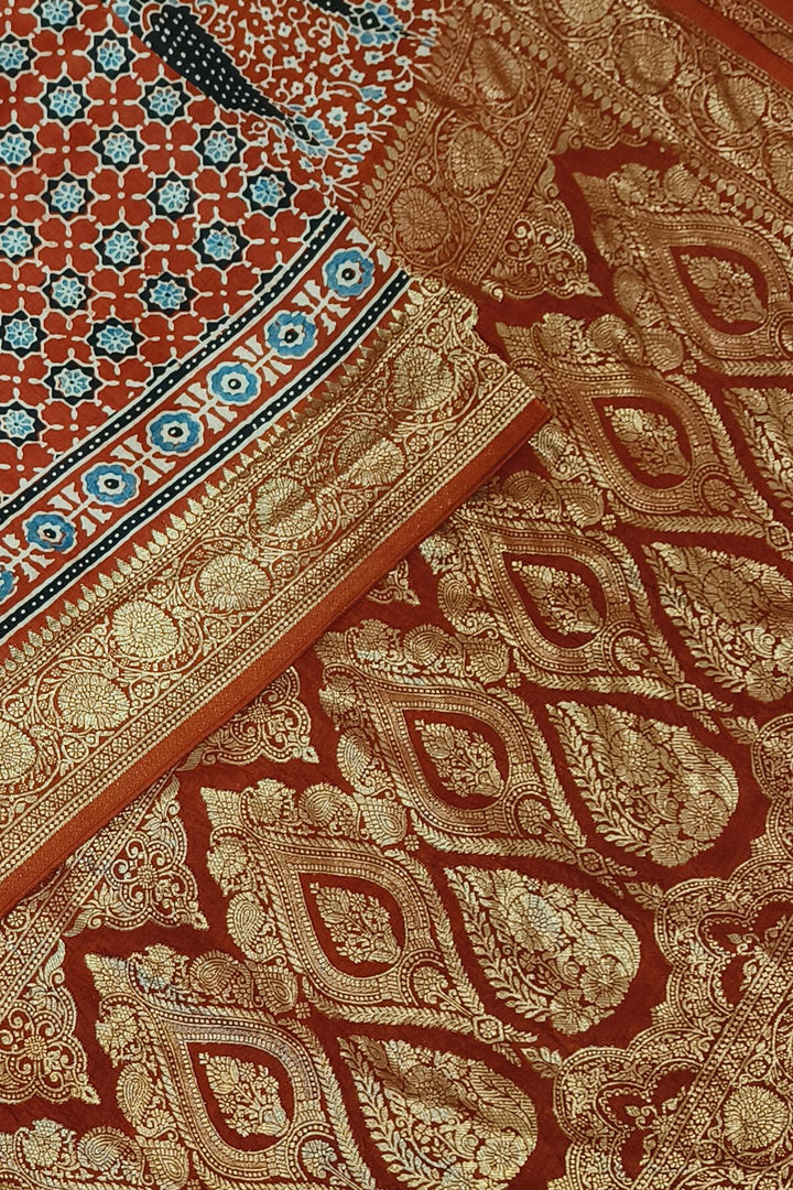 Dola silk saree in red with small motifs  and a contrast pallu in hand block Ajrakh print
